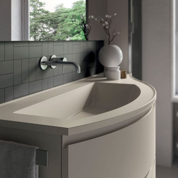 Curved bathroom cabinets with round edged Mineralsolid tops, glossy or matt to match the fronts.
