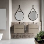 Ring round mirror with a painted metal frame and a black leather-effect hanging strap  - Ideagroup