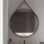 Ring round mirror with a painted metal frame and a black leather-effect hanging strap  - Ideagroup