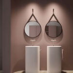 Ring round mirror with a painted metal frame and a black leather-effect hanging strap  - Ideagroup